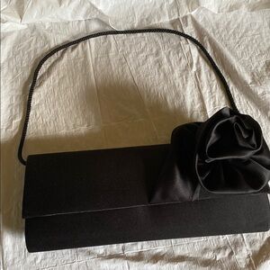 Elegant Black Clutch with Floral Accent